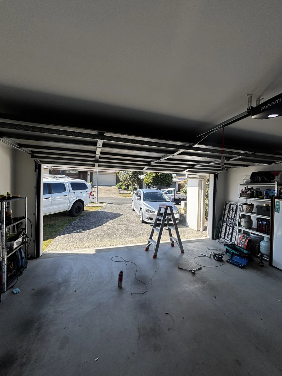 Garage set up for a job, ladder and tools in place