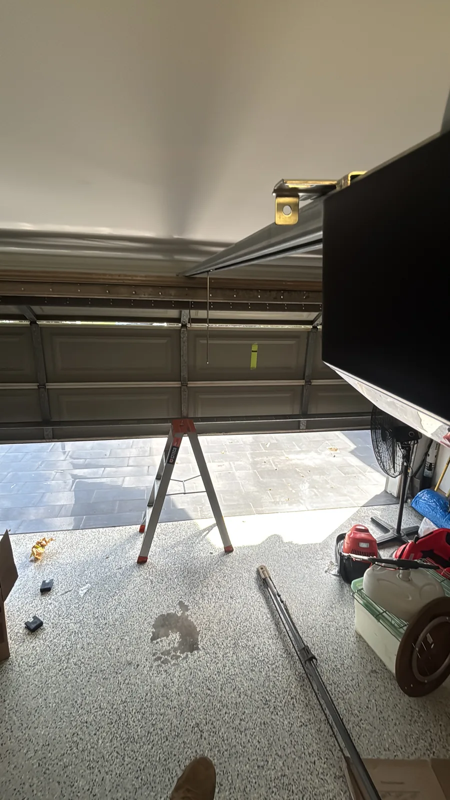 Garage door track and opener mid-installation