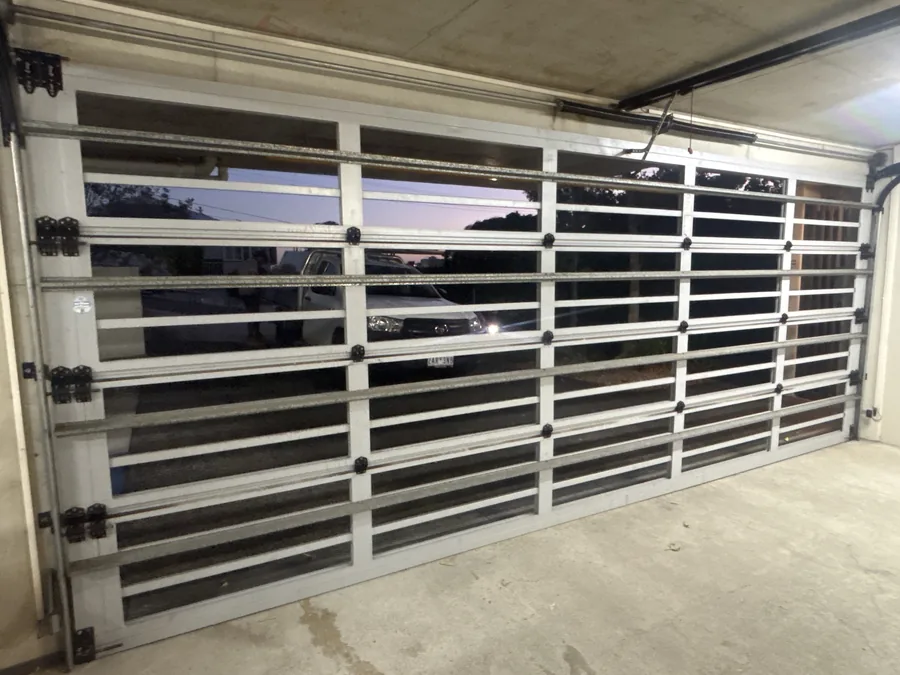 Completed garage door installation, viewed at dusk