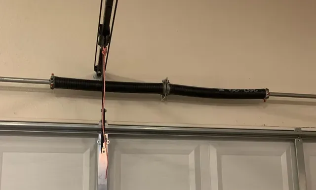 Garage door torsion spring assembly